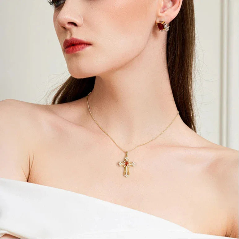 Garnet Cross Pendant Necklace worn at the neckline from a second angle