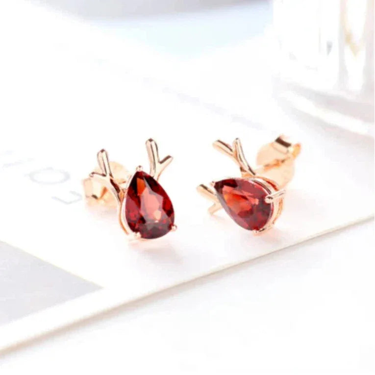 Garnet Deer Stud Earrings angled product detail on a jewelry display