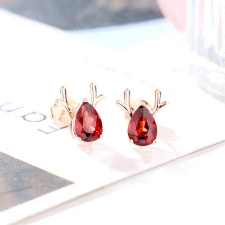 Garnet Deer Stud Earrings side view held between the fingers
