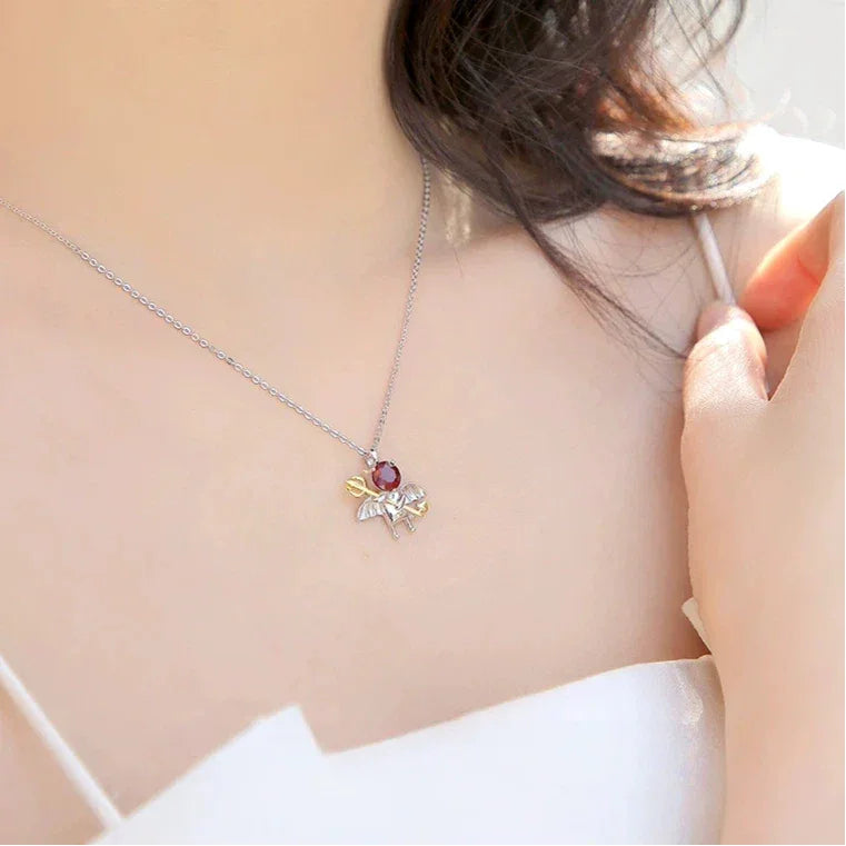 Garnet Devil and Wing Pendant Necklace worn at the neckline from a second angle