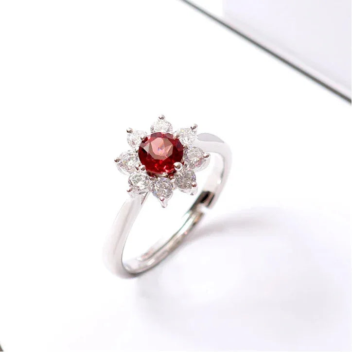 Garnet Floral Halo Adjustable Ring angled product detail on a jewelry display