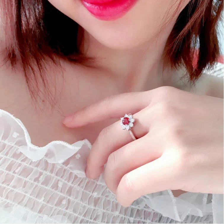 Garnet Floral Halo Adjustable Ring worn on the hand from a second angle