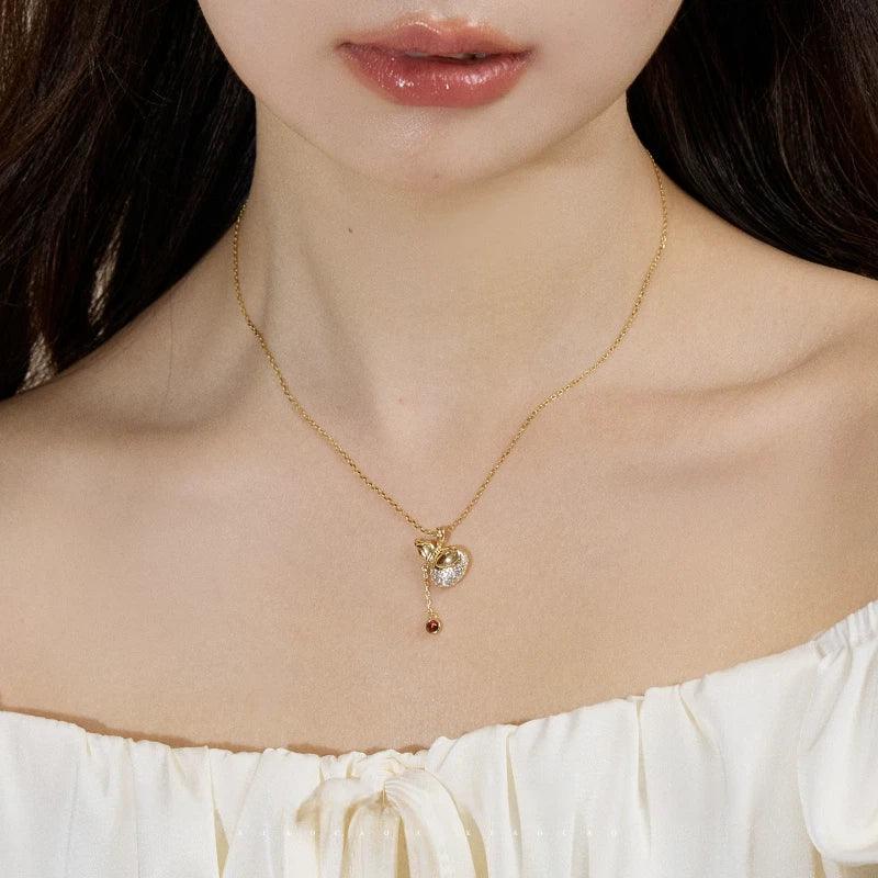 Garnet Gourd Drop Pendant Necklace worn at the neckline from a second angle