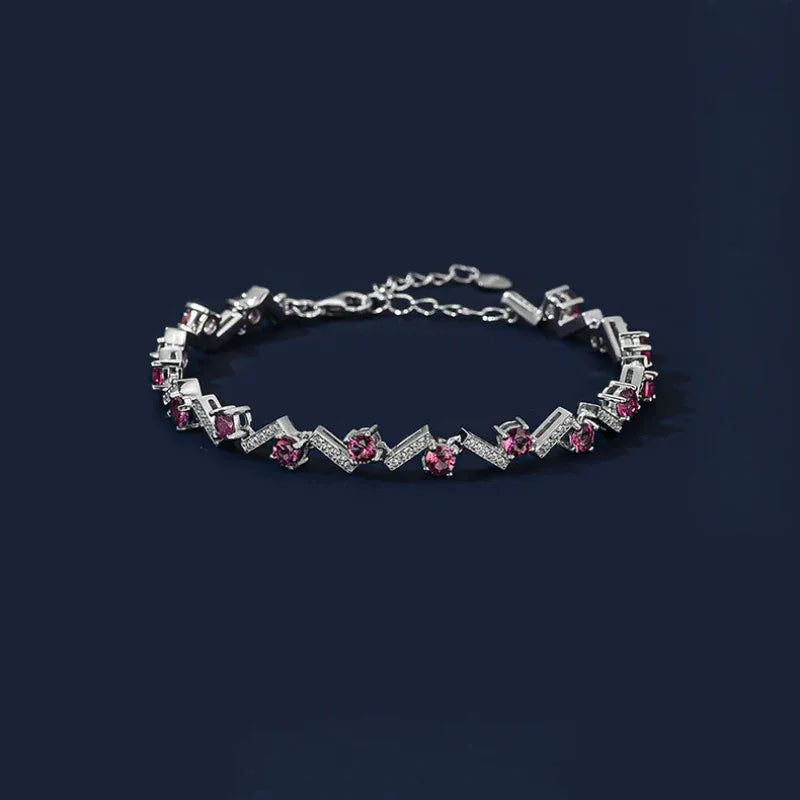 Garnet Leaf-Link Tennis Bracelet full bracelet view on a dark background