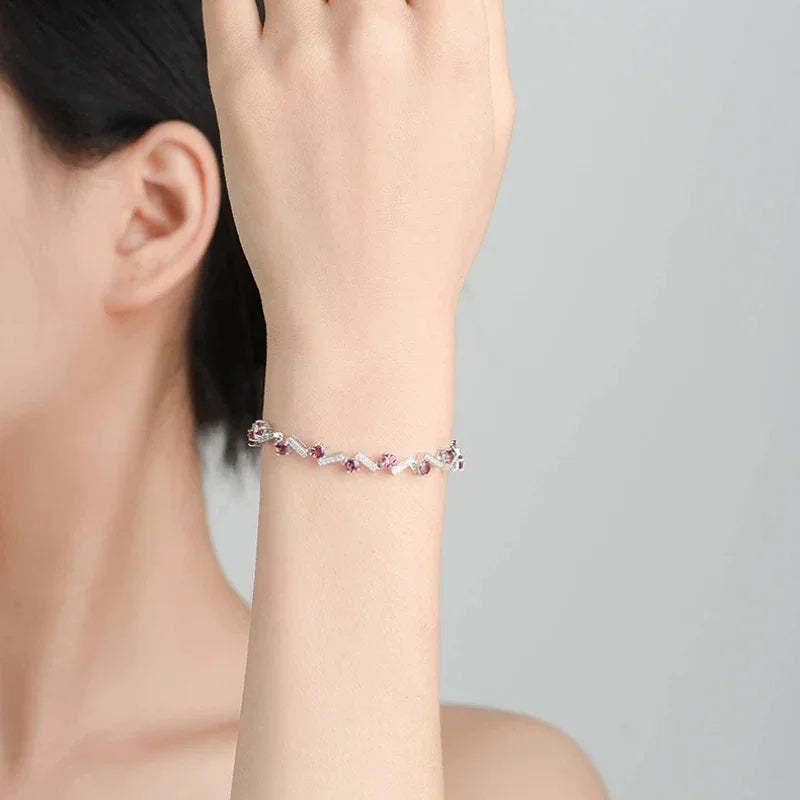 Garnet Leaf-Link Tennis Bracelet worn on the wrist from a second angle