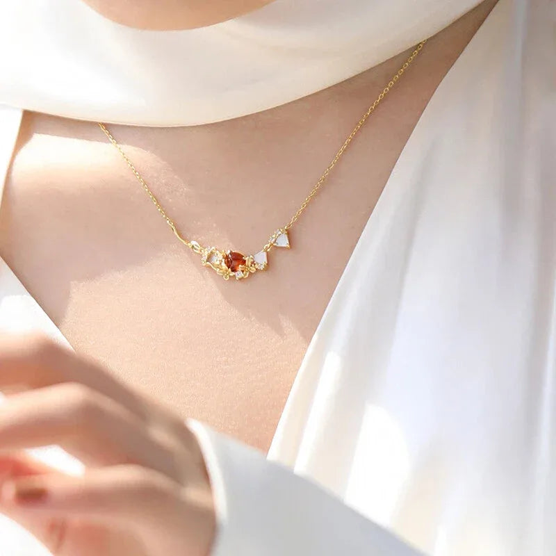 Garnet Multi-Stone Bar Necklace pendant styled on a jewelry display