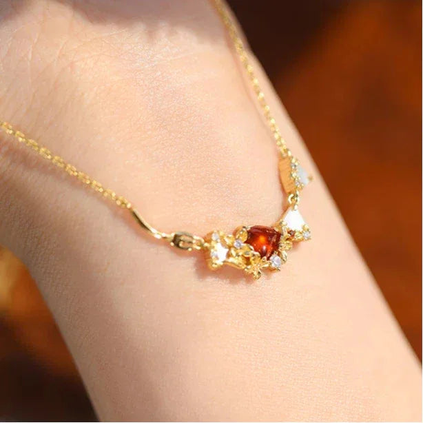 Garnet Multi-Stone Bar Necklace worn at the neckline in a close-up