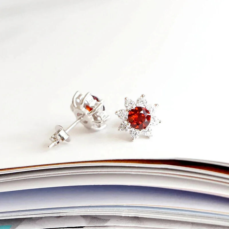 Garnet Snowflake Stud Earrings angled product detail on a jewelry display