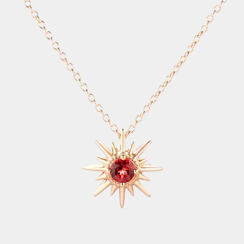 Garnet Sunburst Pendant Necklace full necklace view on a light background
