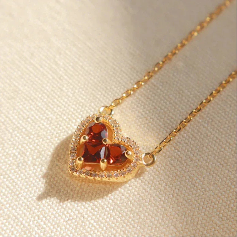 Garnet Triple-Stone Heart Necklace side or angled pendant detail