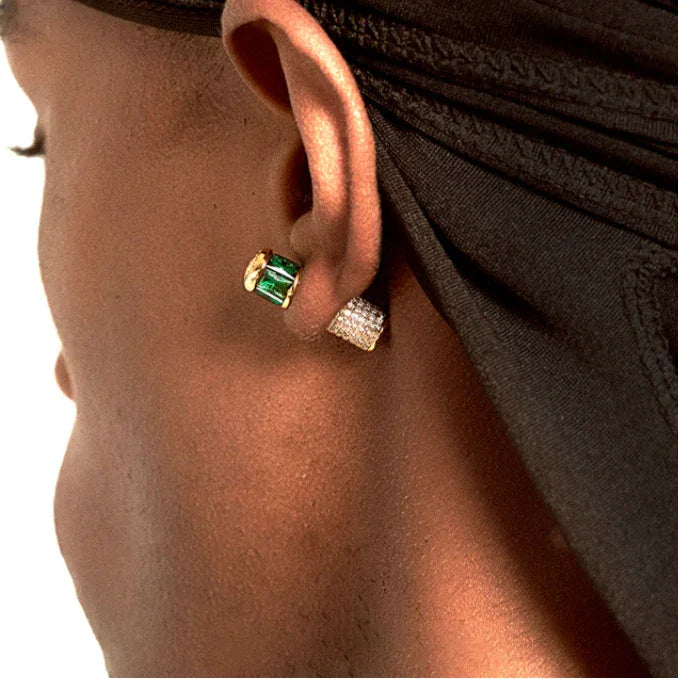Gold-Tone Two-Tone Emerald Cylindrical Stud Earrings worn on the ear in a close-up