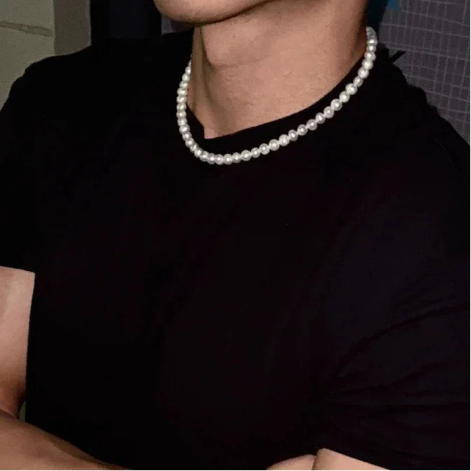 Classic Pearl Strand Necklace — close neckline-worn view over a black shirt