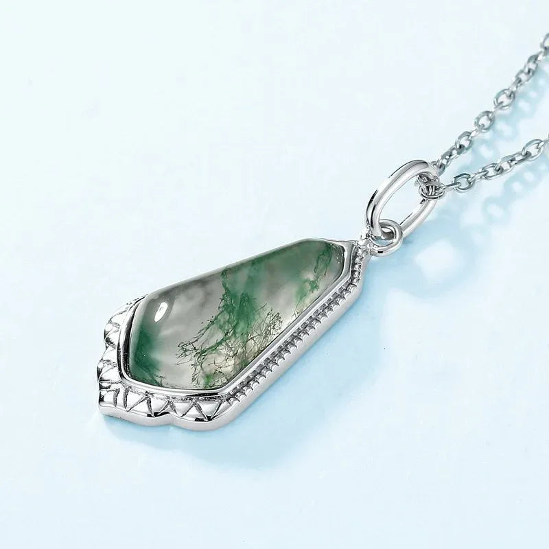 Elongated Teardrop Moss Agate Pendant Necklace — angled pendant close-up showing setting depth