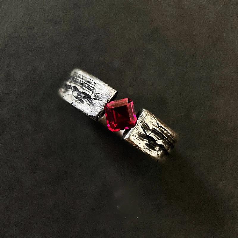 Hammered Silver-Tone Ruby Open Ring — close-up of ruby setting