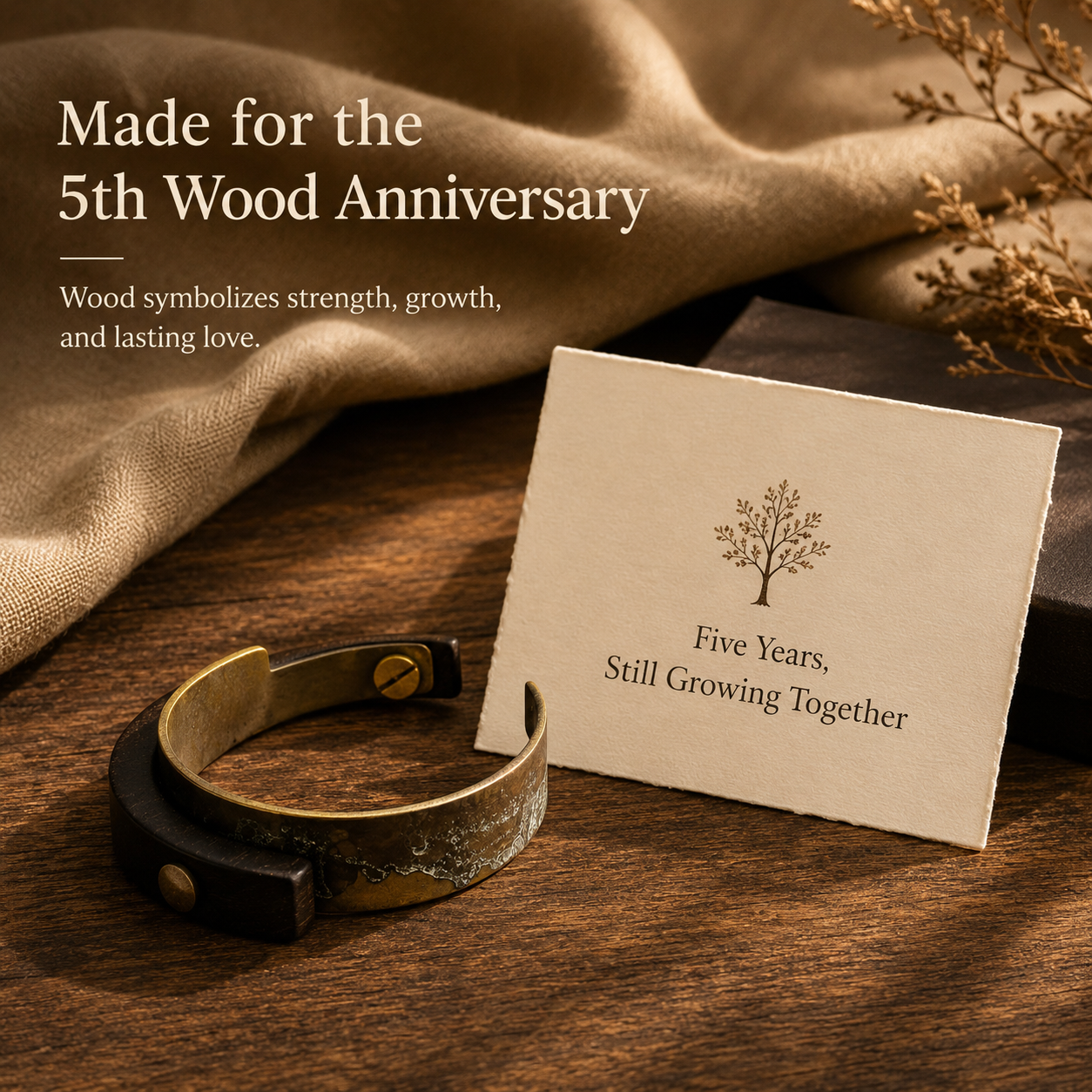 Handmade Ebony Wood & Aged Brass Open Cuff Bracelet, styled product scene with anniversary-themed props
