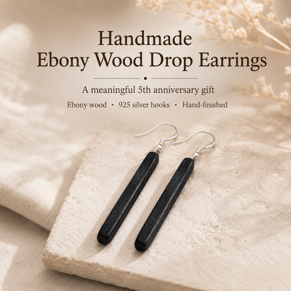Handmade Ebony Wood Long Drop Earrings, styled product scene with anniversary-themed props
