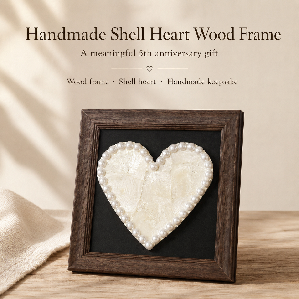 Handmade Shell Heart Wood Frame, styled product scene with anniversary-themed props