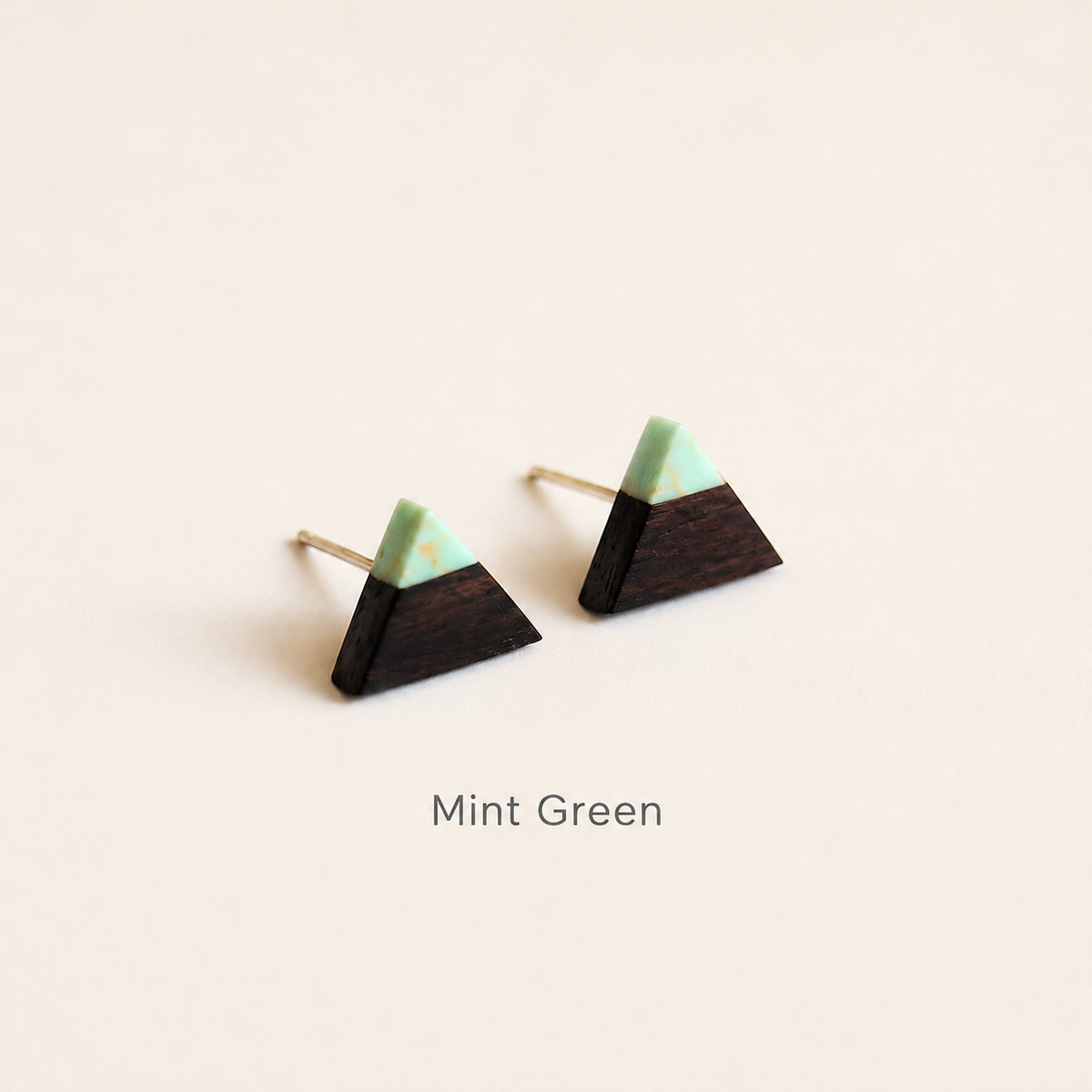 Handmade Wooden Triangle Stud Earrings, product view on a neutral background