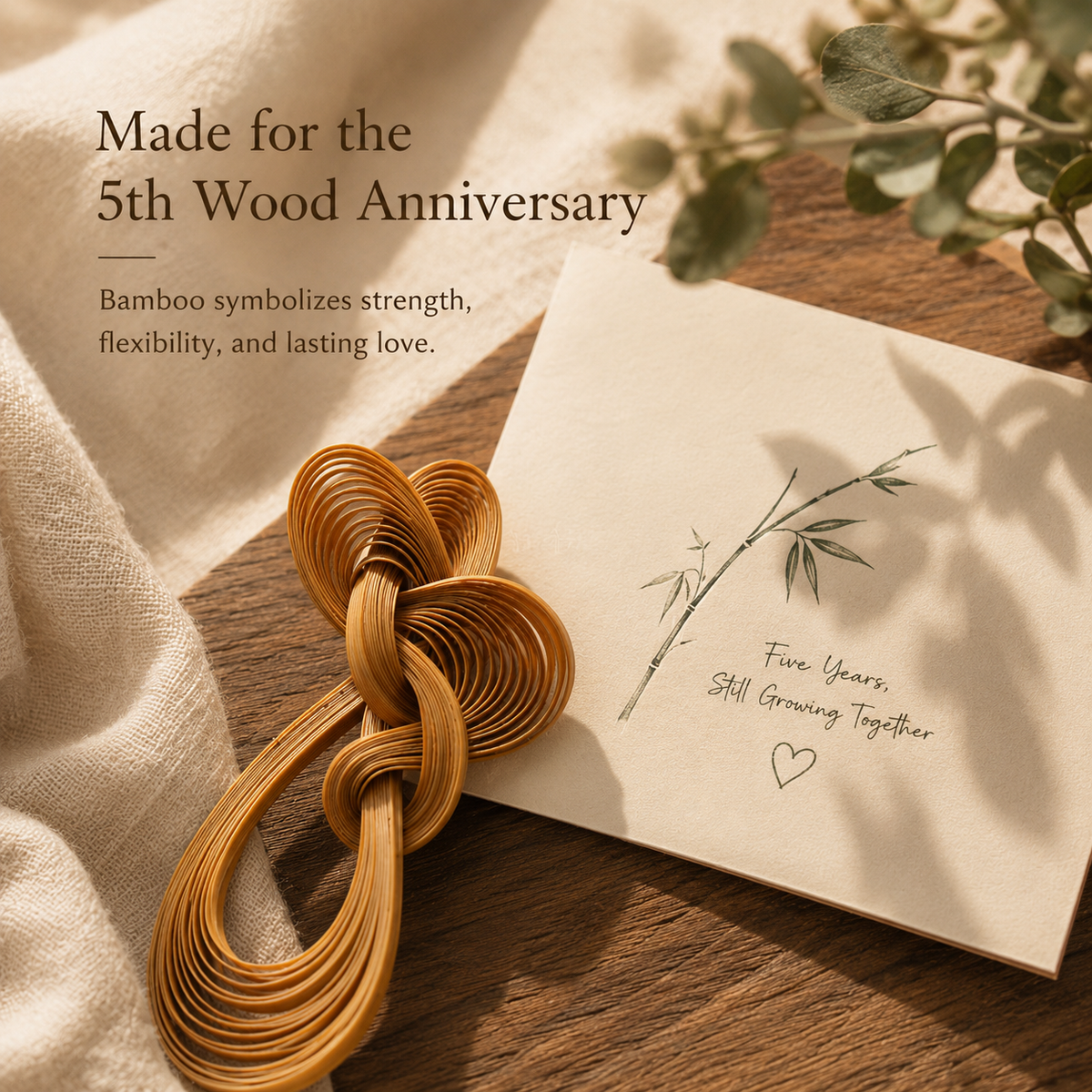 Handwoven Bamboo Knot Brooch, styled product scene with anniversary-themed props