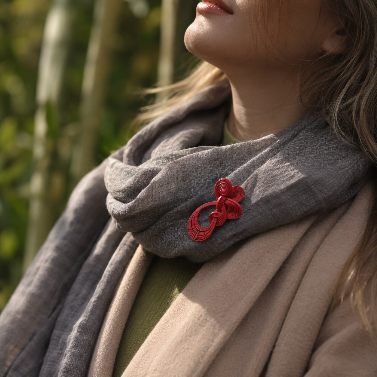 Handwoven Bamboo Knot Brooch, shown worn for scale and styling
