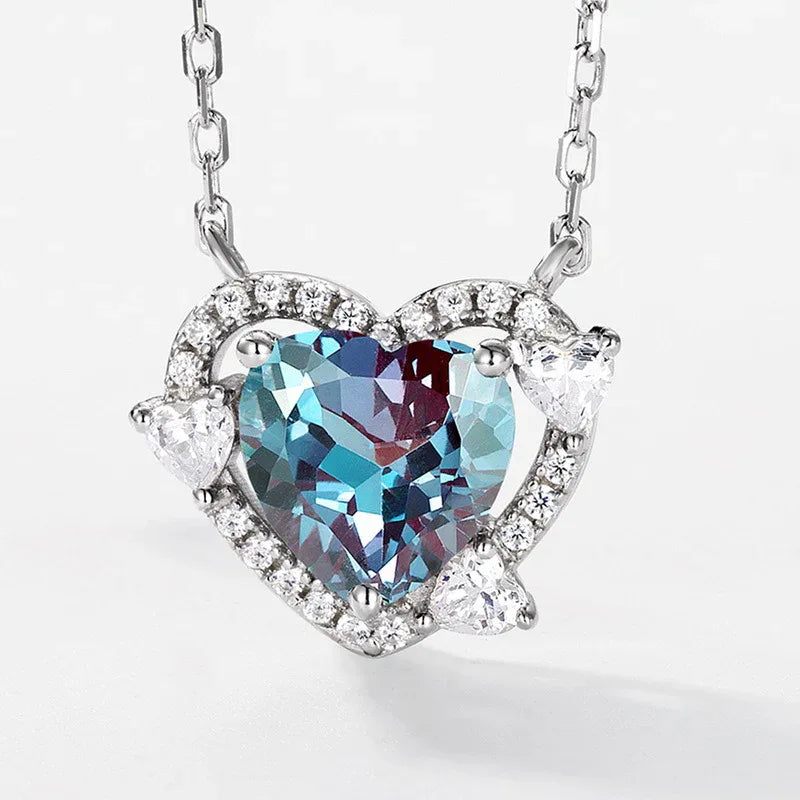 Heart Alexandrite halo pendant necklace with clear accents, close-up showing the setting and decorative accents