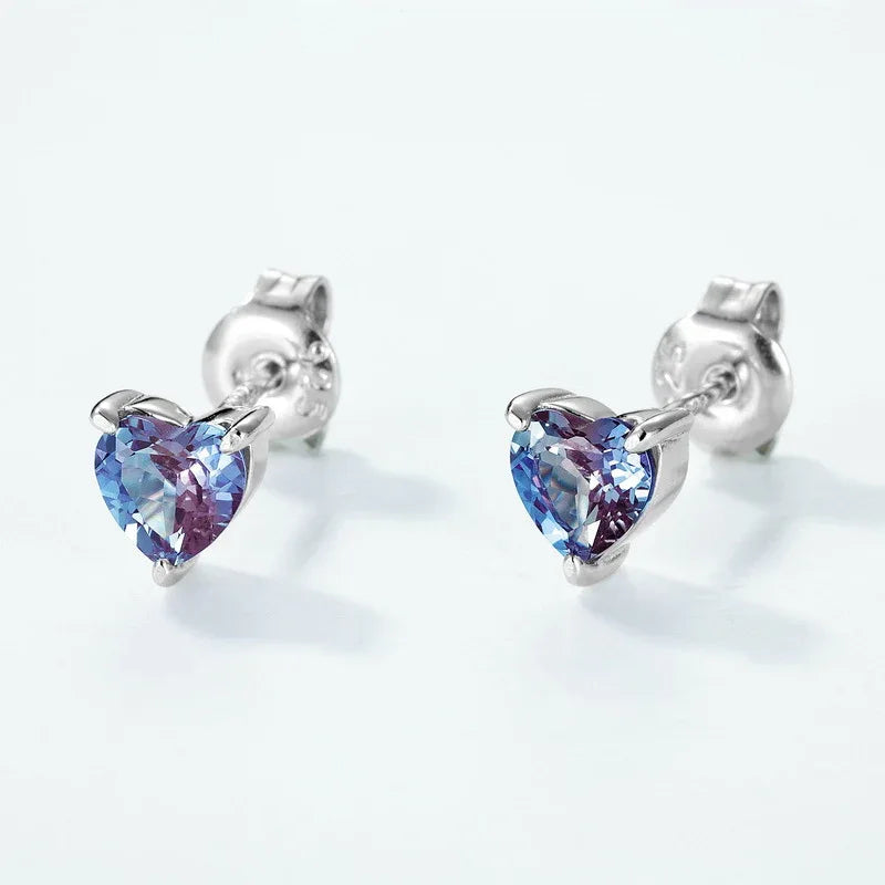 Heart Alexandrite stud earrings, center stone close-up on a white background