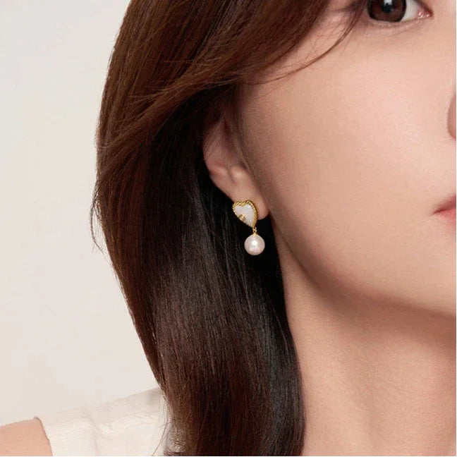 Pearl Drop Heart Earrings with Clear Center Accents — right-ear worn portrait
