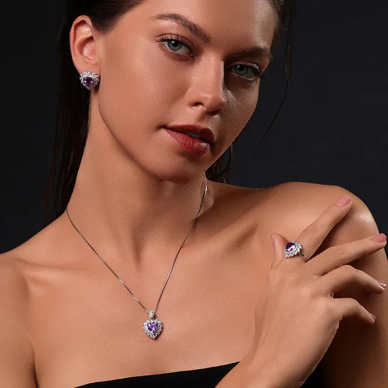 heart-cut amethyst halo necklace worn at the neckline in a close-up