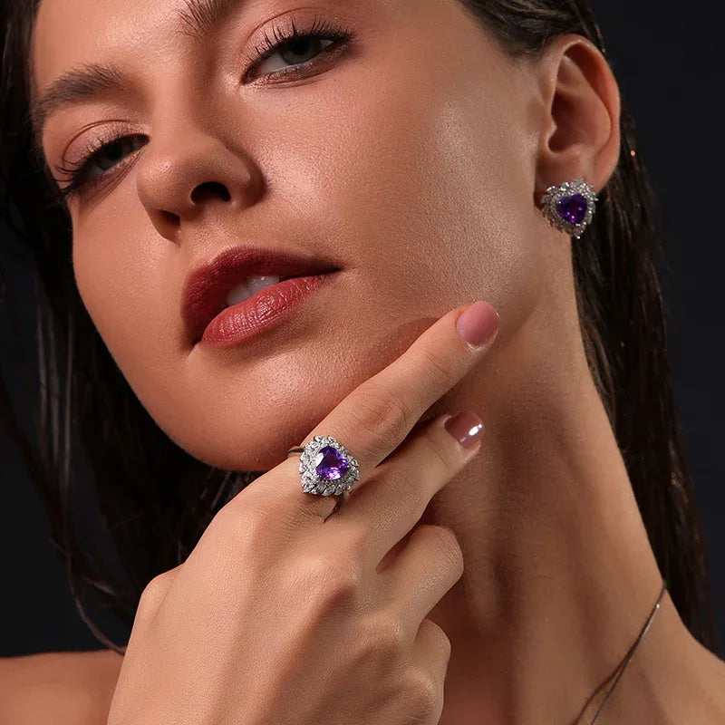 heart-cut amethyst halo ring worn on the hand in a close-up
