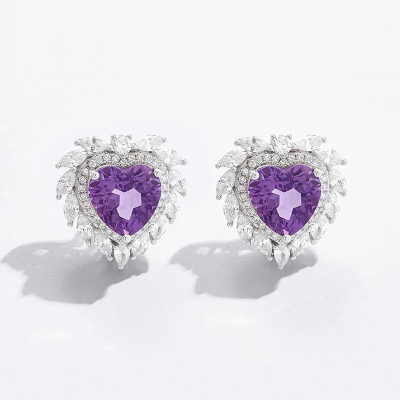 heart-cut amethyst stud earrings styled portrait showing the earrings for scale