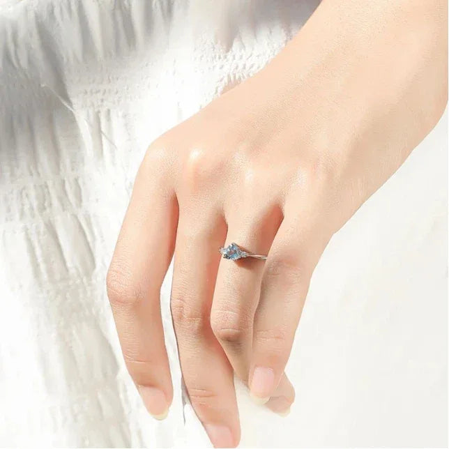 Heart-Cut Aquamarine Accent Ring worn on the hand from a second angle