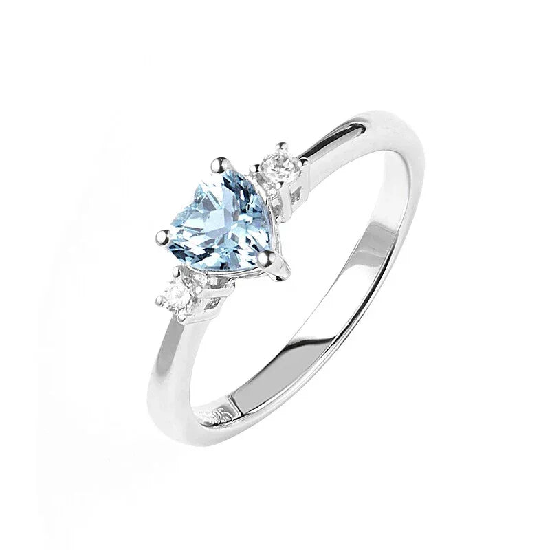 Heart-Cut Aquamarine Accent Ring worn on the hand in a close-up