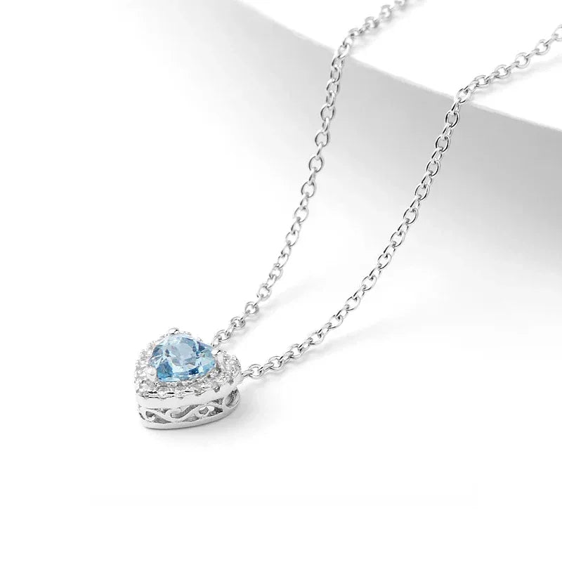 Heart-Cut Aquamarine Halo Pendant Necklace angled pendant detail on white