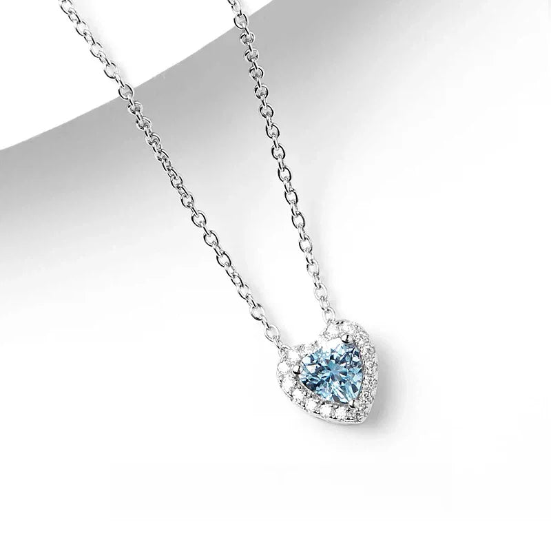 Heart-Cut Aquamarine Halo Pendant Necklace pendant and chain detail on a light background