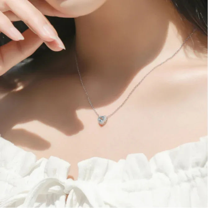 Heart-Cut Aquamarine Halo Pendant Necklace worn at the neckline from a second angle