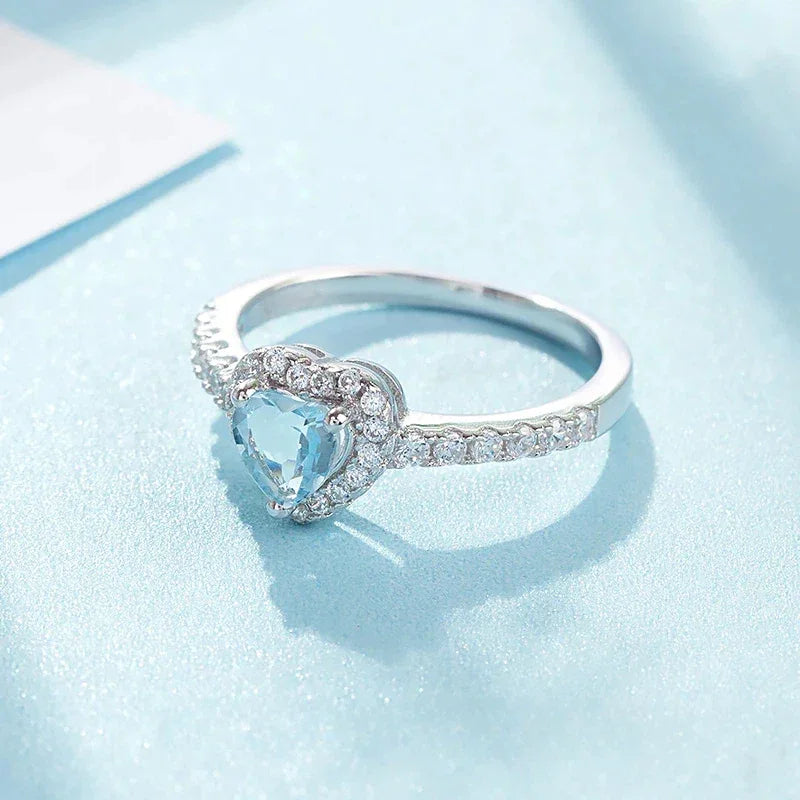 Heart-Cut Aquamarine Pave Ring worn on the hand in a close-up
