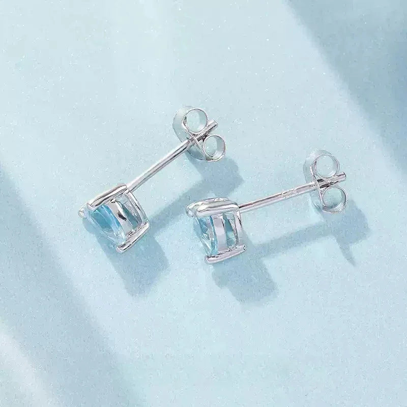 Heart-Cut Aquamarine Stud Earrings worn on the ear from a second angle
