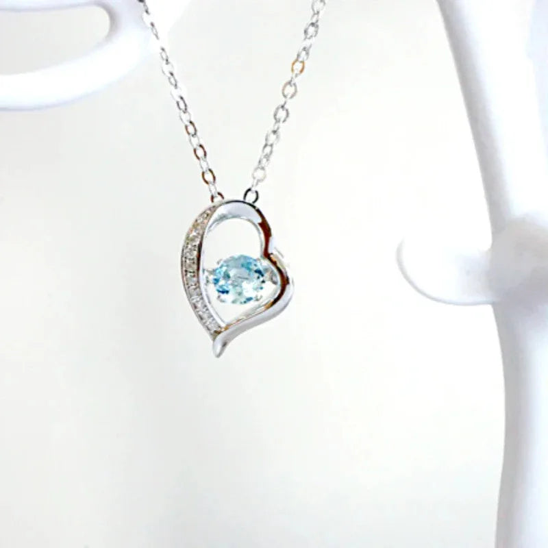 Heart-Cut Aquamarine Swirl Pendant Necklace pendant and chain detail on a light background