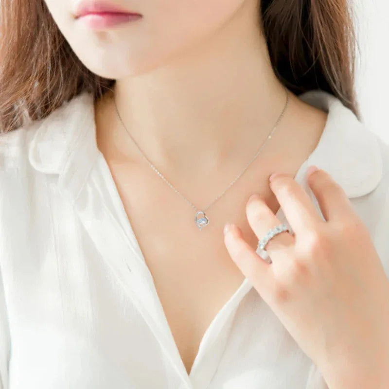 Heart-Cut Aquamarine Swirl Pendant Necklace worn at the neckline from a second angle