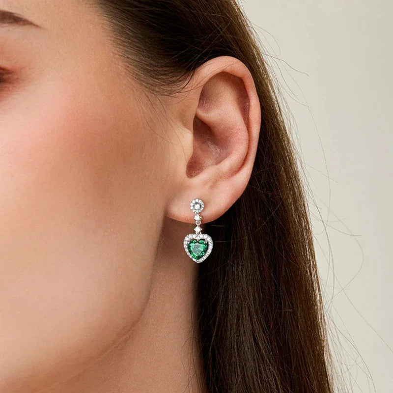 Heart-Cut Emerald Drop Earrings worn on the ear from a second angle