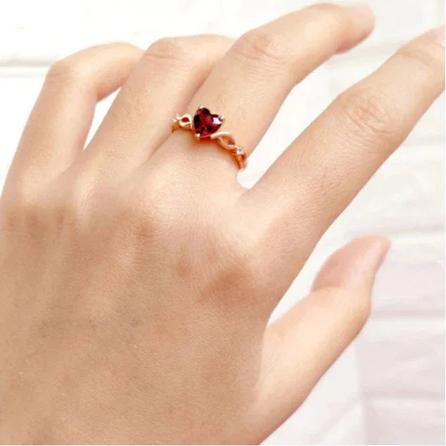 Heart-Cut Garnet Adjustable Ring worn on the hand from a second angle