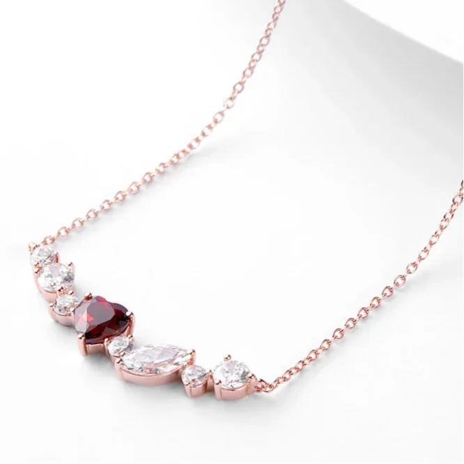 Heart-Cut Garnet Choker Necklace pendant styled on a jewelry display