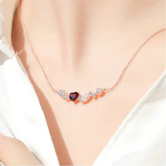 Heart-Cut Garnet Choker Necklace worn at the neckline in a close-up