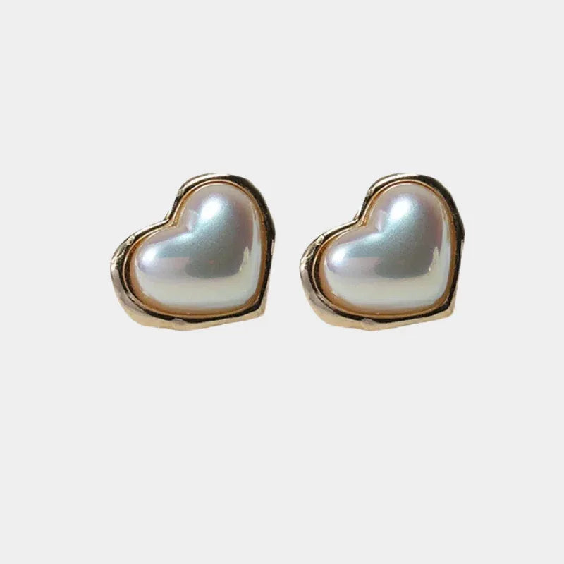 Heart-Shaped Pearl Stud Earrings — front pair of heart-shaped pearl studs with gold-tone borders