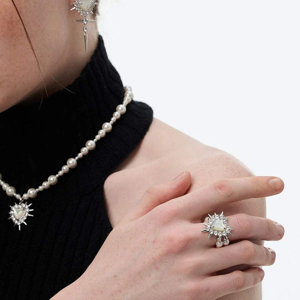 Spiked Pearl Cluster Statement Ring — coordinated worn view with a pearl necklace