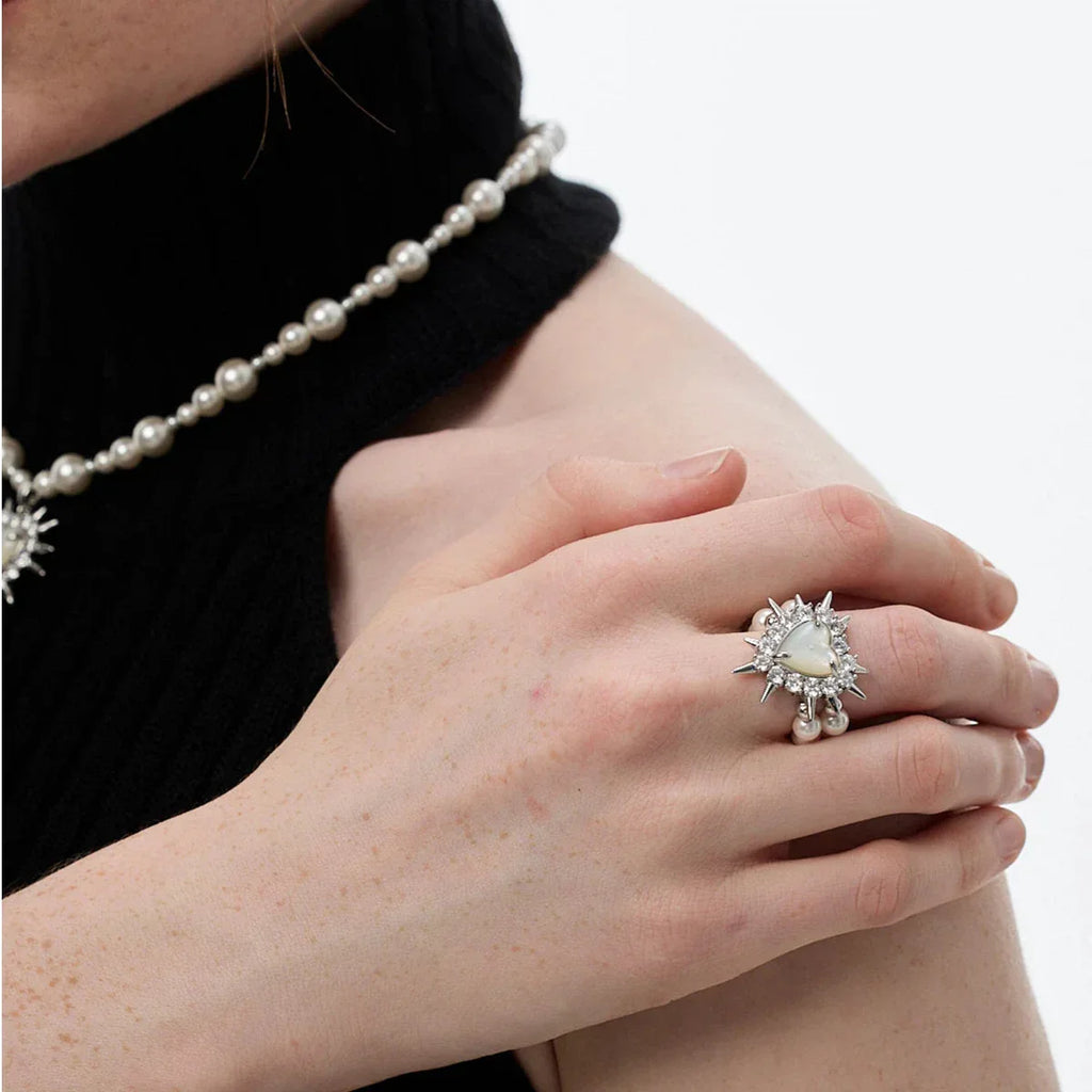 Spiked Pearl Cluster Statement Ring — alternate hand-worn view over a black sleeve