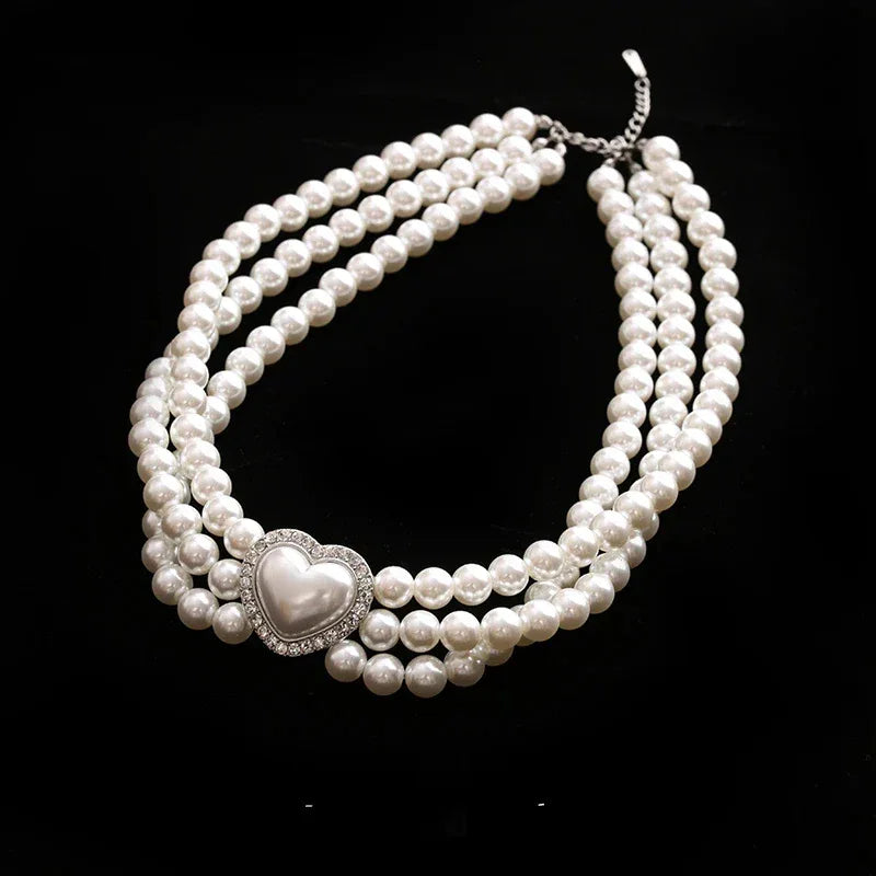Triple-Strand Pearl Heart Choker Necklace — necklace displayed on a black background