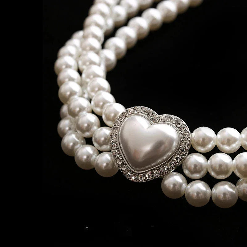 Triple-Strand Pearl Heart Choker Necklace — macro view of the raised pearl heart and three surrounding strands