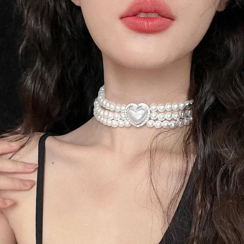 Triple-Strand Pearl Heart Choker Necklace — front neckline-worn portrait showing the close choker fit