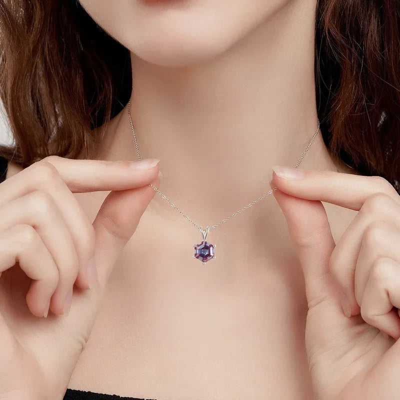 Hexagon Alexandrite pendant necklace with a three-bar bail, shown worn in a close lifestyle view